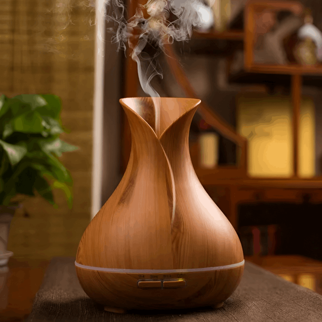 wooden essential oil diffuser on a table - diffuseur d'huiles essentielles en bois 