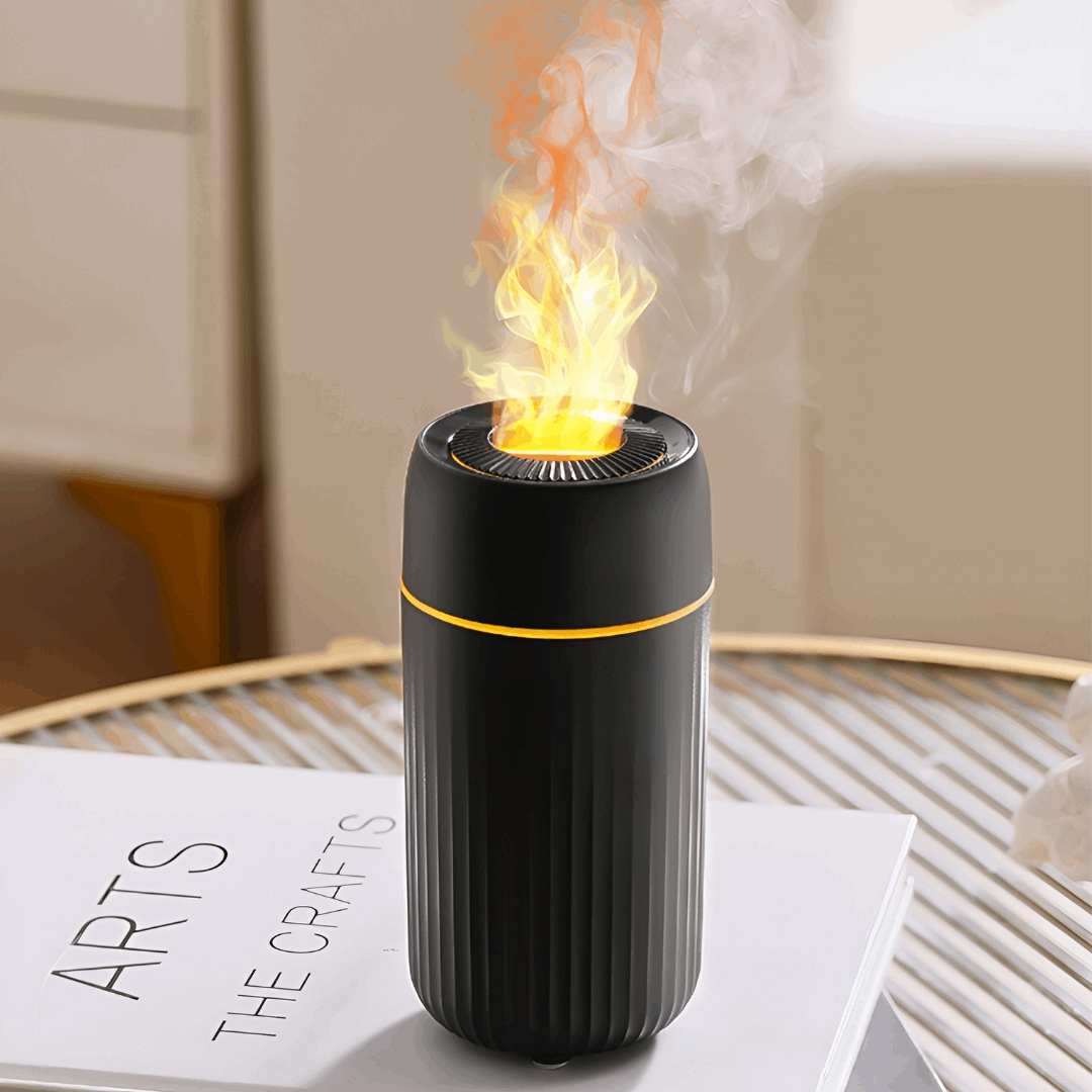 mini black essential oil diffuser - diffuseur d'huiles essentiel noir sur une table - vlf shop