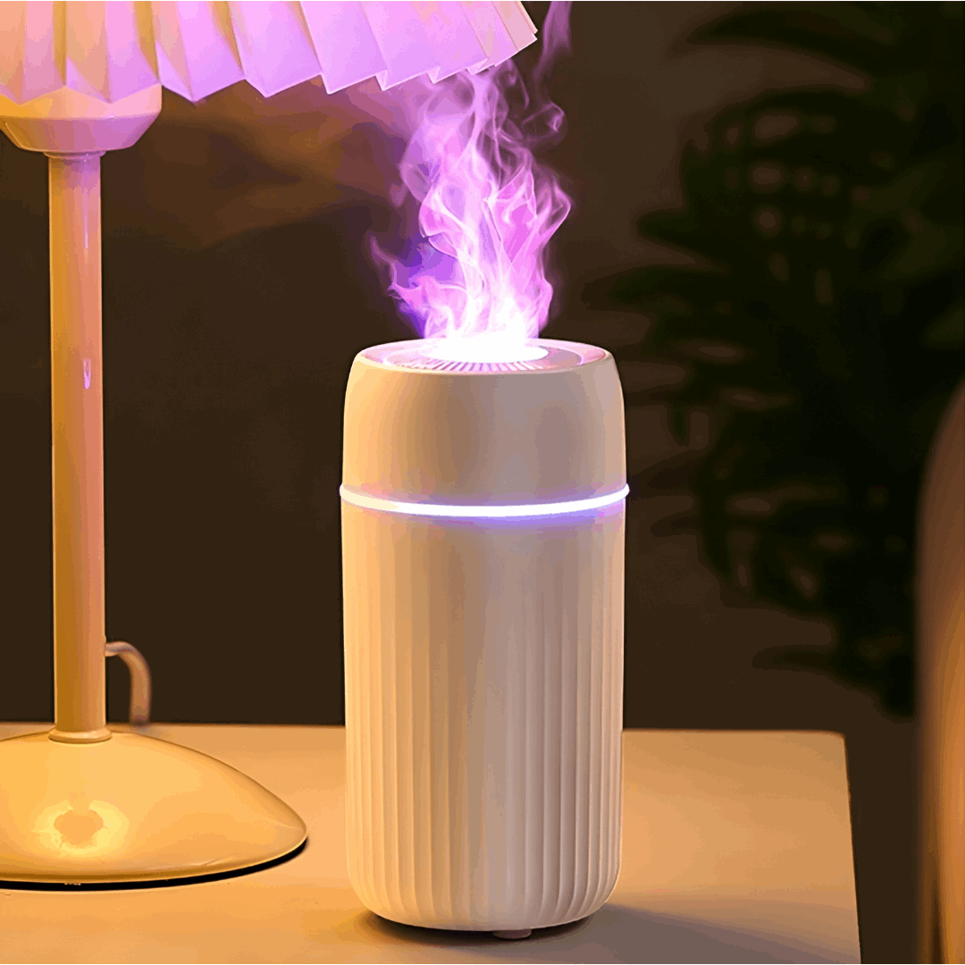 white essential oil diffuser on a table - diffuseur blanc sur ne table de nuit